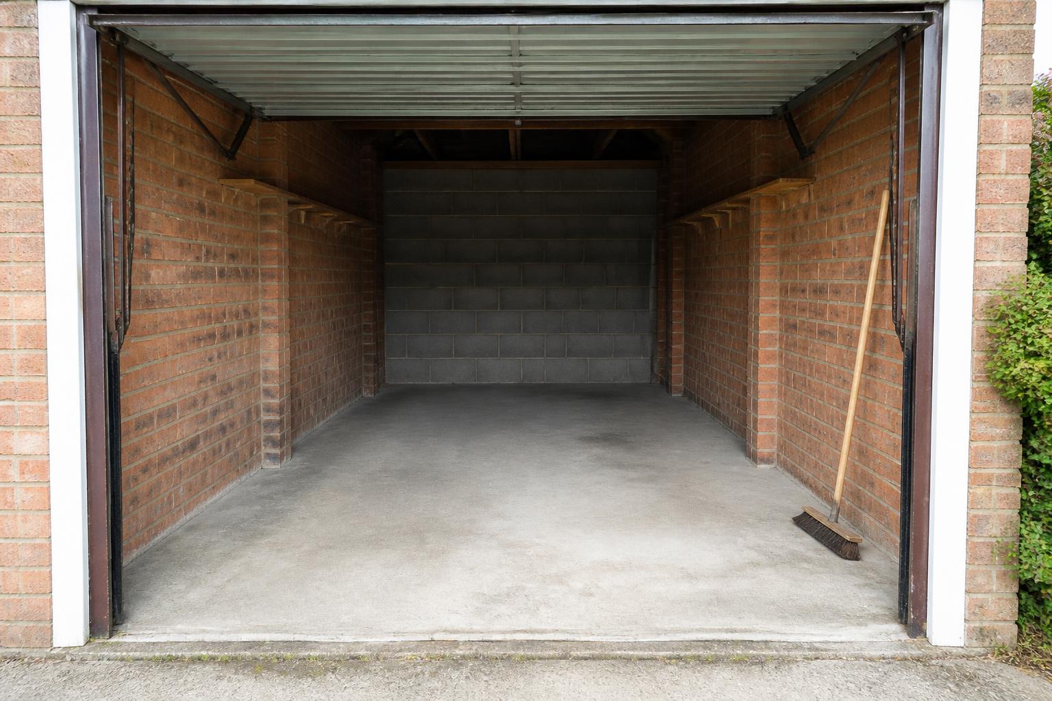 Empty garage swept clean and ready to use after a full clearance